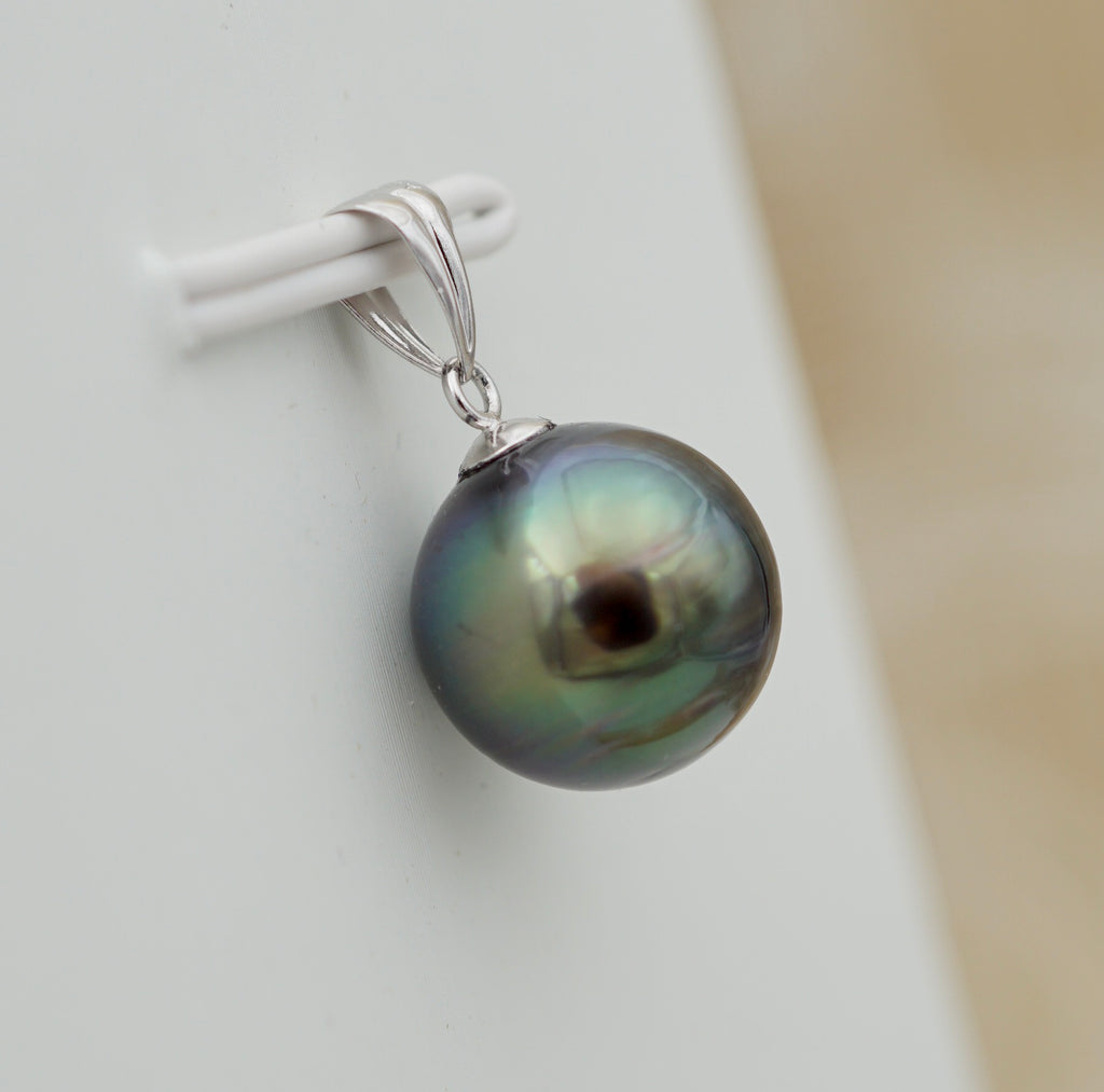 Collection Tiare perle cerclée de 10.6mm sur or 18k