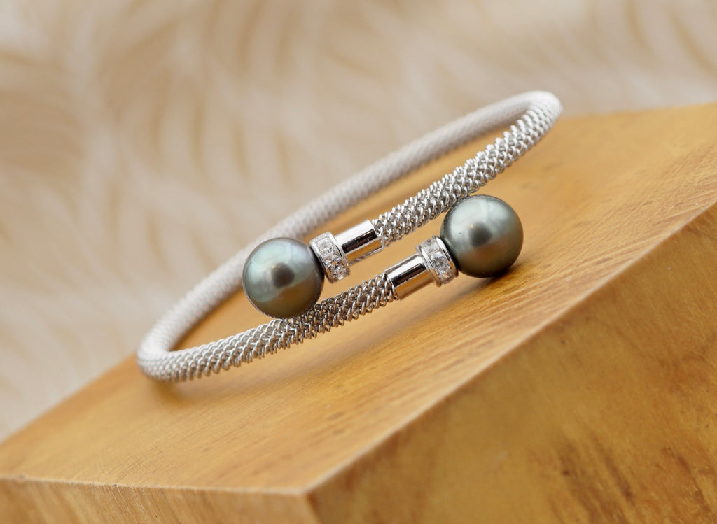 Splendide bracelet en argent rodhié orné de deux véritables perles de Tahiti AAA